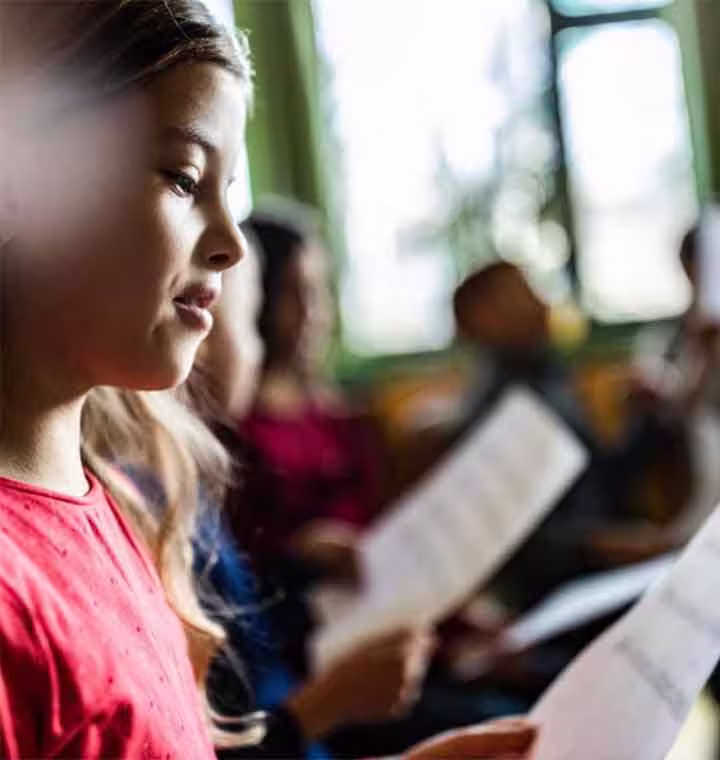 girl-reading-in-class