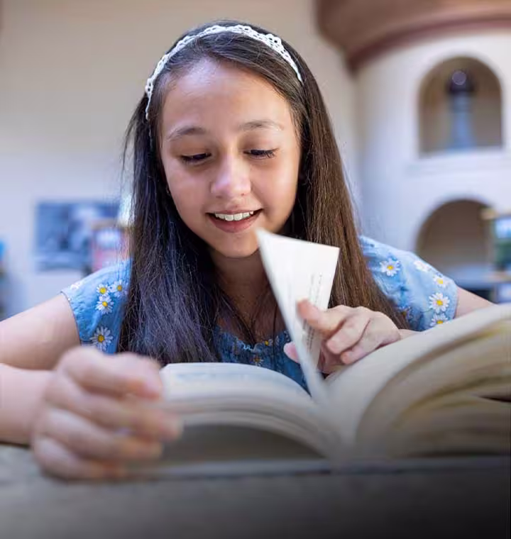 girl-student-flipping-the-page-of-a-book